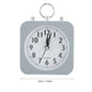 Réveil carré gris avec cadran blanc et chiffres noirs, dimensions indiquées en centimètres et pouces.